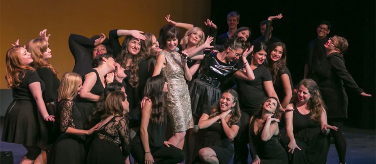 Actresses on stage swoon during a musical number.