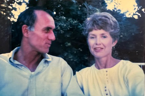 Jack looks over at Trude McDermott as they sit in front of a