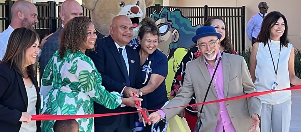 Juan Felipe Herrera and other dignitaries cut the ribbon to the elementary school