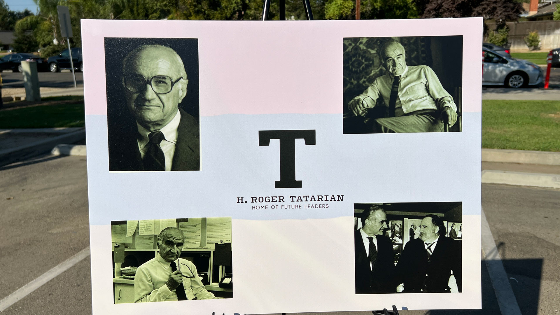 Board on an easel shows photos of H. Roger Tatarian.