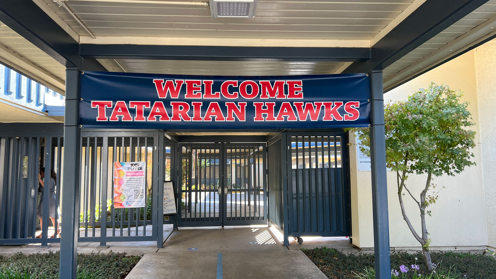 Sign welcomes Tatarian Hawks at the entrance to the school
