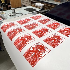 Cards imprint created by Brown through screen printing process.