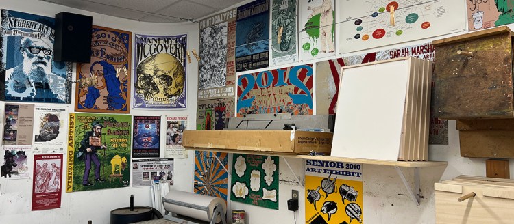 Various posters and art work done by students with displayed all over the wall.