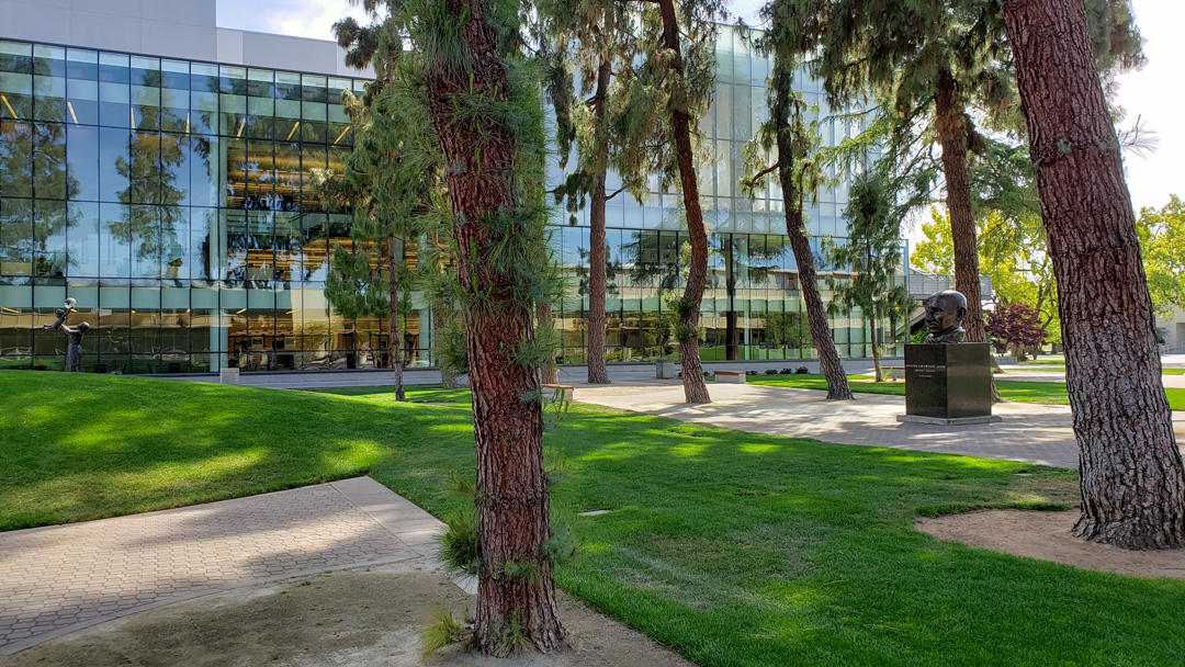 The Peace Garden with the bust of Gandhi and the Fresno State Library in the background.