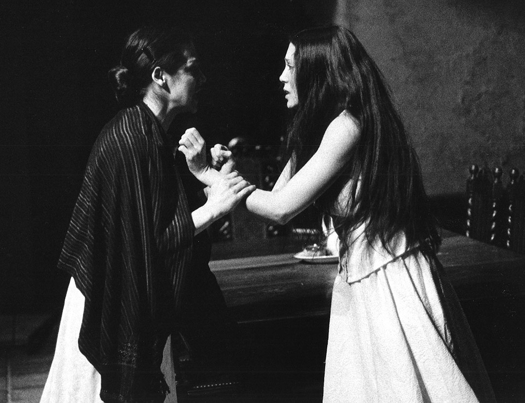 Black and white photos of Toni Wein acting in a stage production as another actress grips her wrists in a dramatic scene.