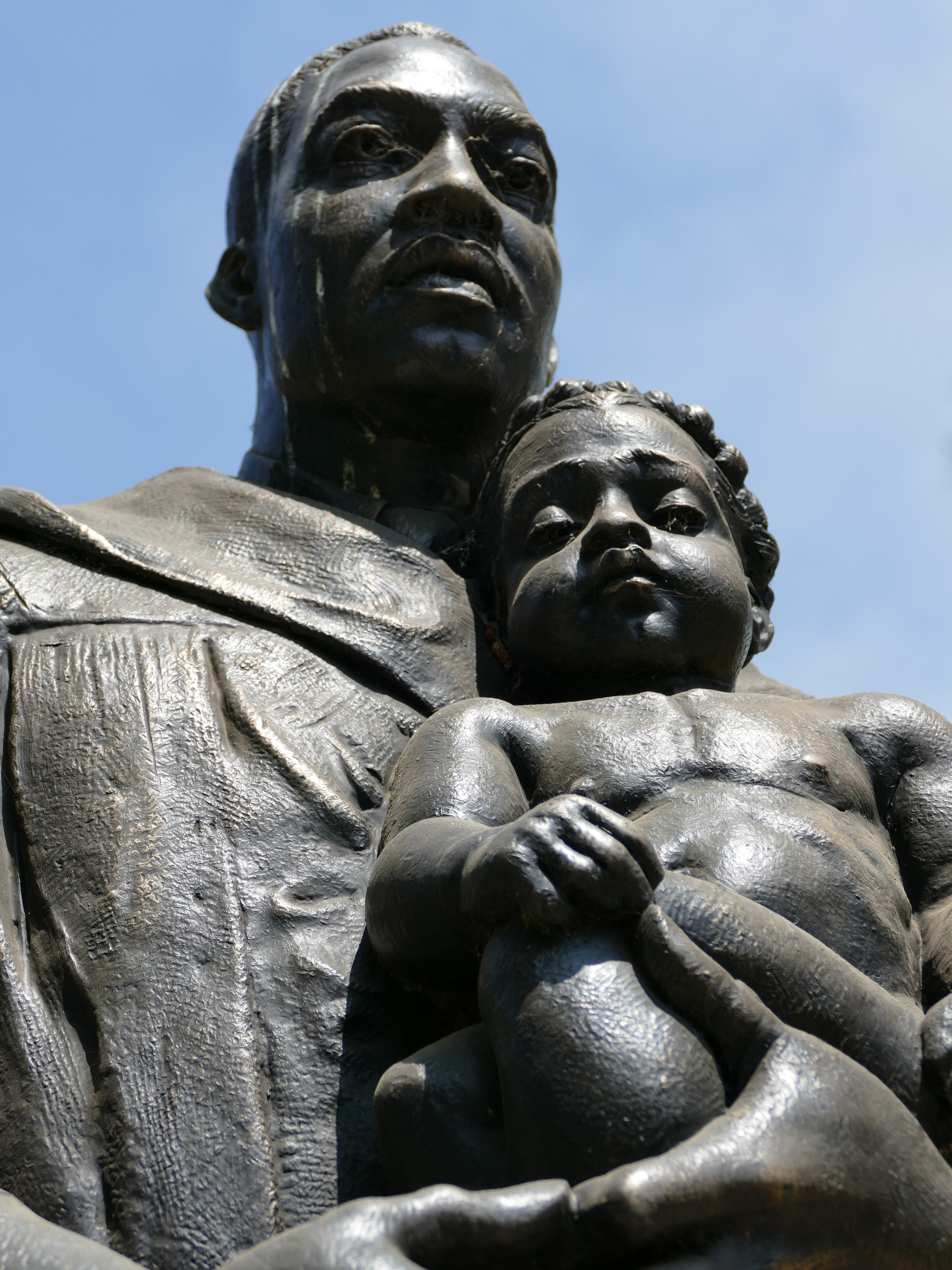 Statue of Dr. Martin Luther King, Jr. holding a baby in the Peace Garden at Fresno State.