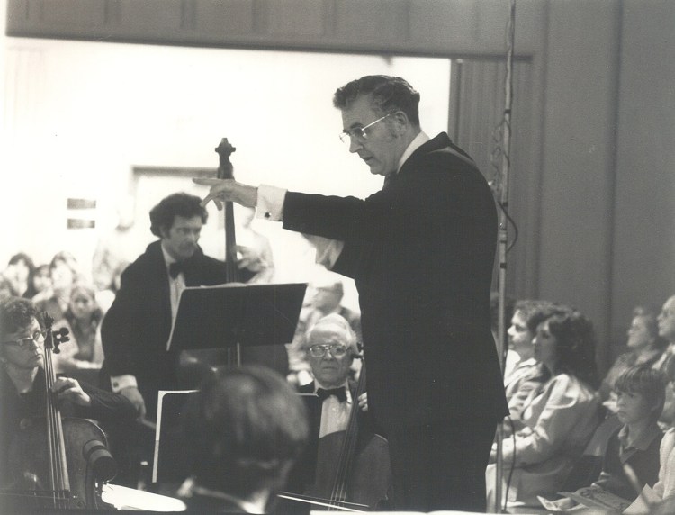 Dr. Arthur Huff conducts a concert sometime in the 1970's