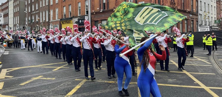 Members of the Bulldog Marching Band in Dublin, Ireland marching in the St. Patrick's Day Parade with the Mountain West Conference All Star Band.