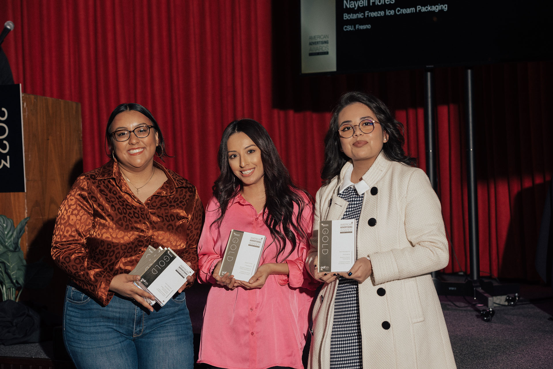 Students Alicia Benitez, Nayeli Flores and Sela Bloodgood show off their gold awards.