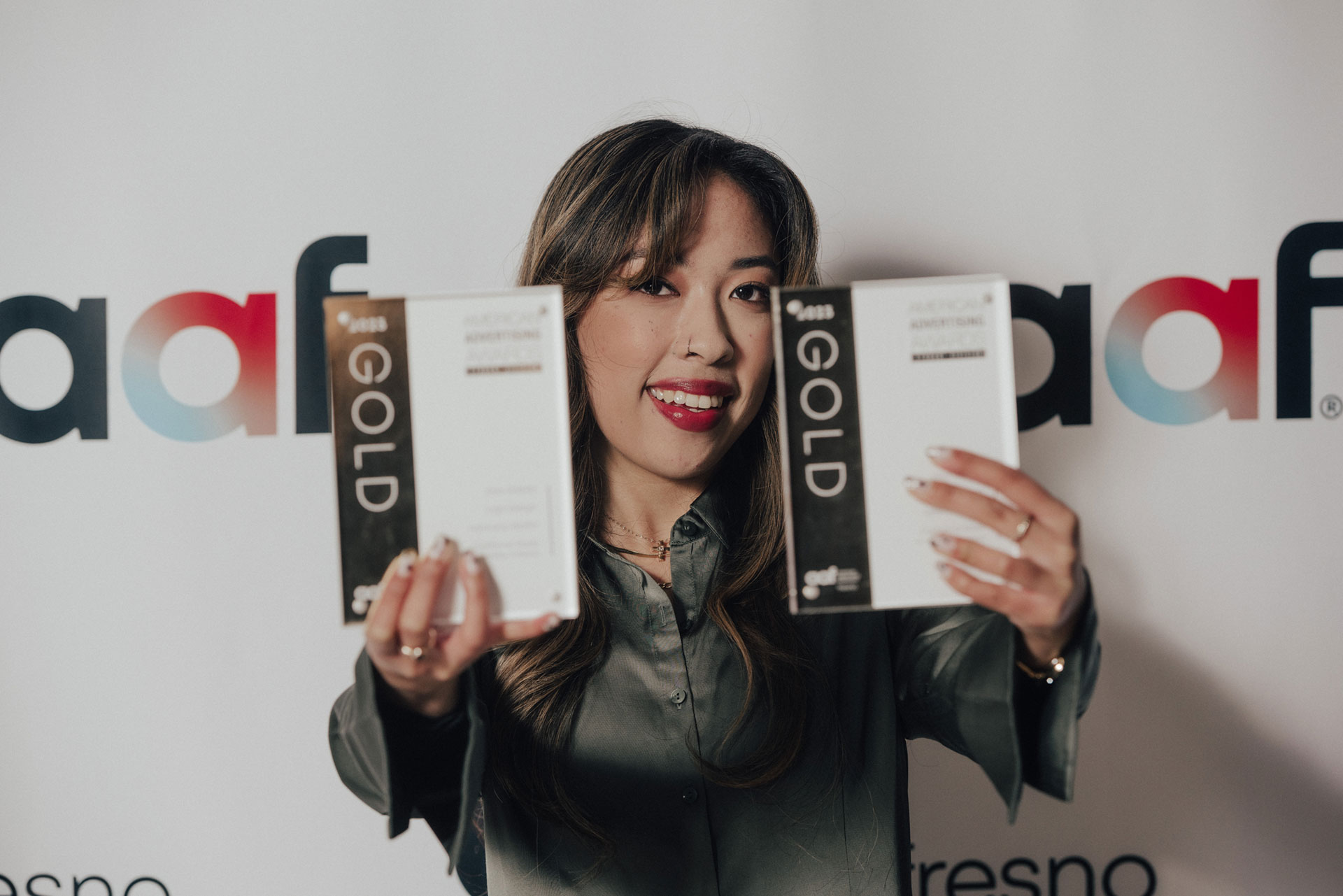 Eliza Gabito shows off her local gold awards