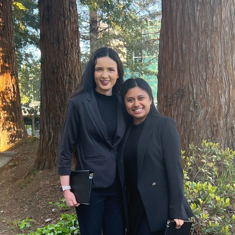 Melissa Tejeda and Hannah Chand, partners for duo interpretation, pose during Sacramento State's Hornet Cup.