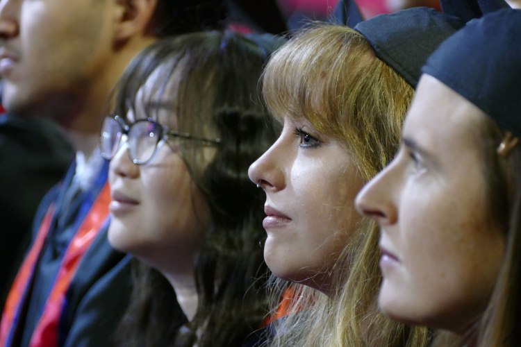 Graduate Dean's Medalist Mialise Carney sits among her pears in the English Department.