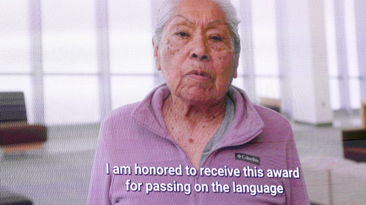 Dr. Holly Blossom Wyatt delivers her acceptance speech on the video video during the commencement ceremony.