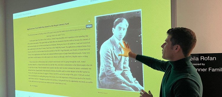 Lucca Lorenzi shows off his group presentation of "The Bloomsbury Boys"