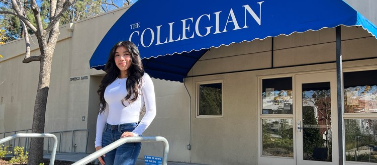 Jazmin Alvarado stands in front of The Collegian student newspaper office.