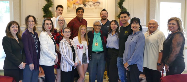 A group shot of Joe Garcia, his family and university representatives.