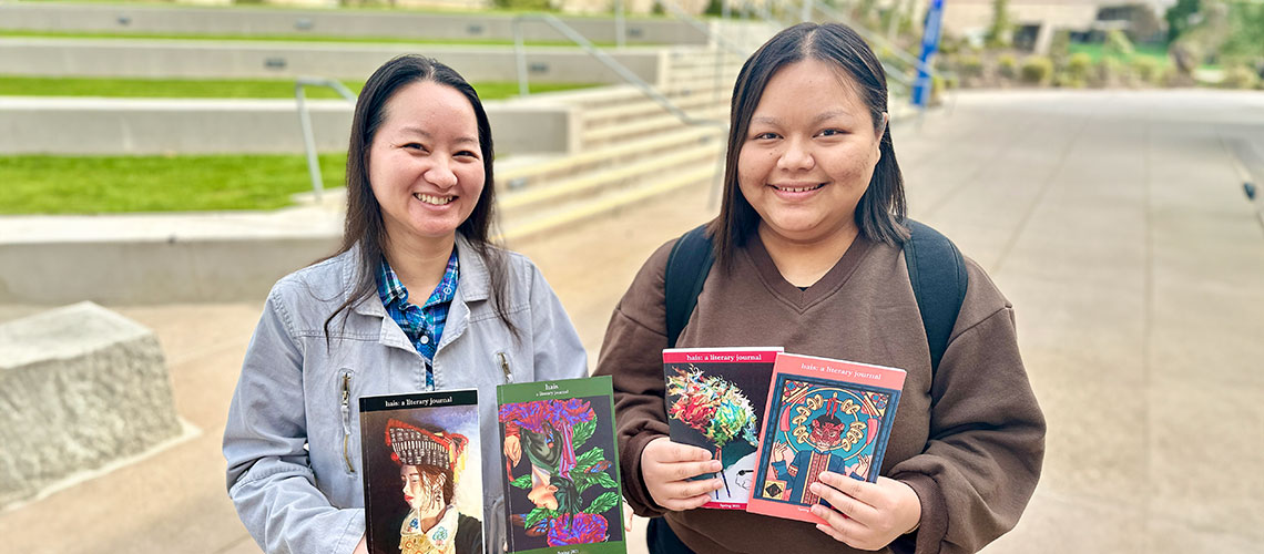 Hmong American Ink and Stories club co-founder Yia Lee, left, and current president Phoua Lee with copies of the first four issues of hais: a literary journal.