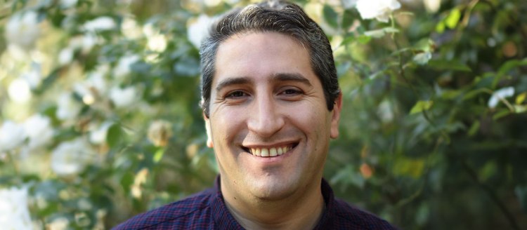 Dr. David Zakarian headshot in front of greenery