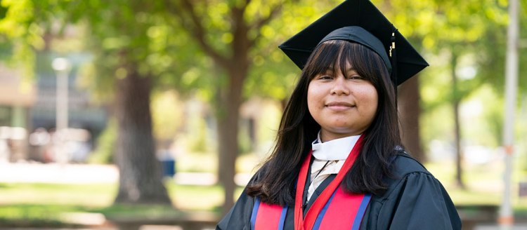 2024 Graduate Dean's Medalist for the College of Arts and Humanities Hermelinda Hernandez Monjaras in her graduation regalia.