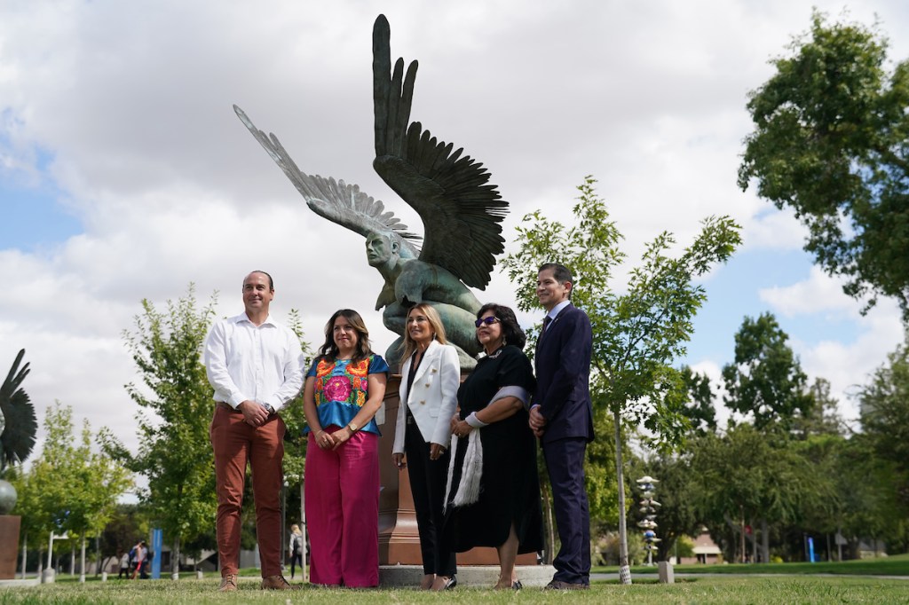 Two representatives from the México Sonsulado En Fresno stand with Vice President of Administration and Chief Financial Officer Deborah Deborah Adishian-Astone, Executive Director of the Fresno Arts Council Dr. Lilia Chavez and President of Fresno State Dr. Saúl Jiménez-Sandoval.