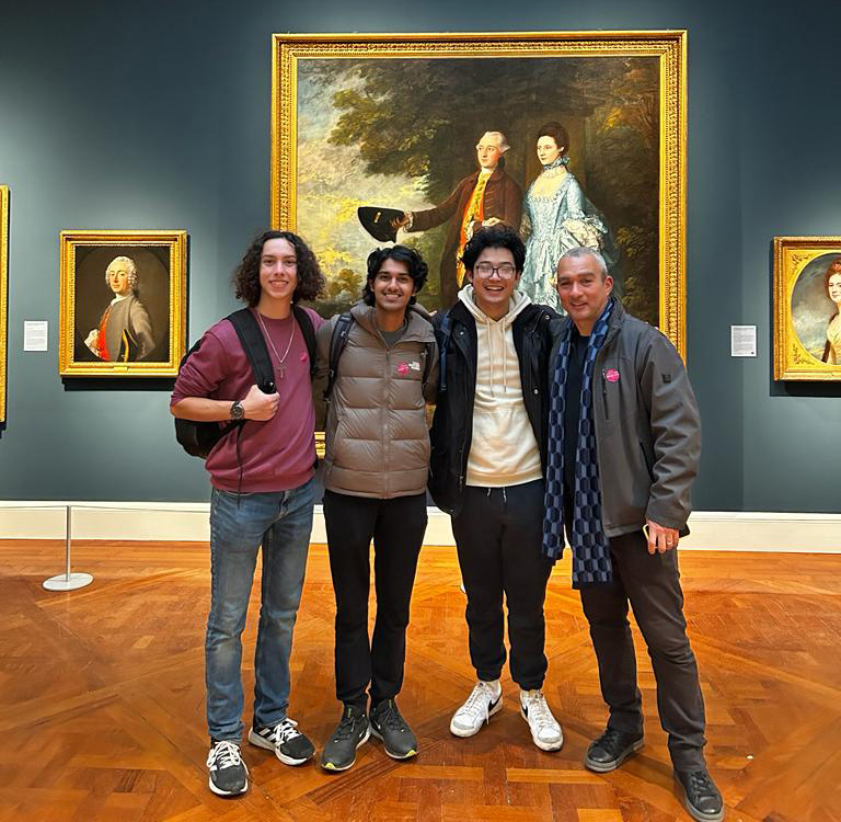 Professor Nick Potter (left) and students in the National Gallery in London.