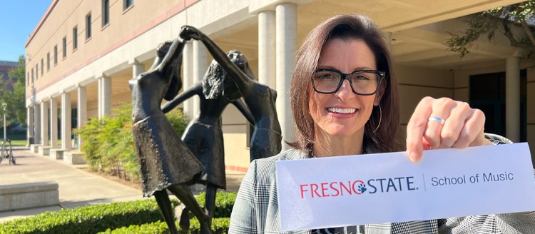 Dr. Cari Dr. Cari Earnhart, chair of the School of Music in front of the New Music Building