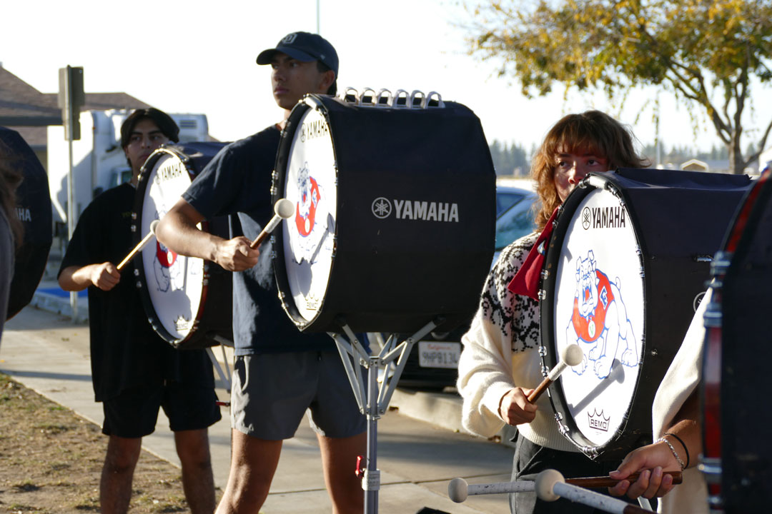 The bass drum line during a practice.