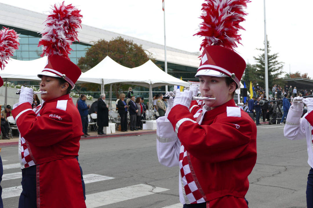 Elli Lyznick plays her piccolo at the Veterans Day Parade in Downtown Fresno.