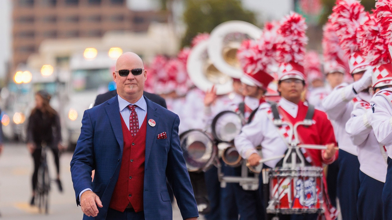 Steven McKeithen walks next to the drum line at the 2023 Rose Parade