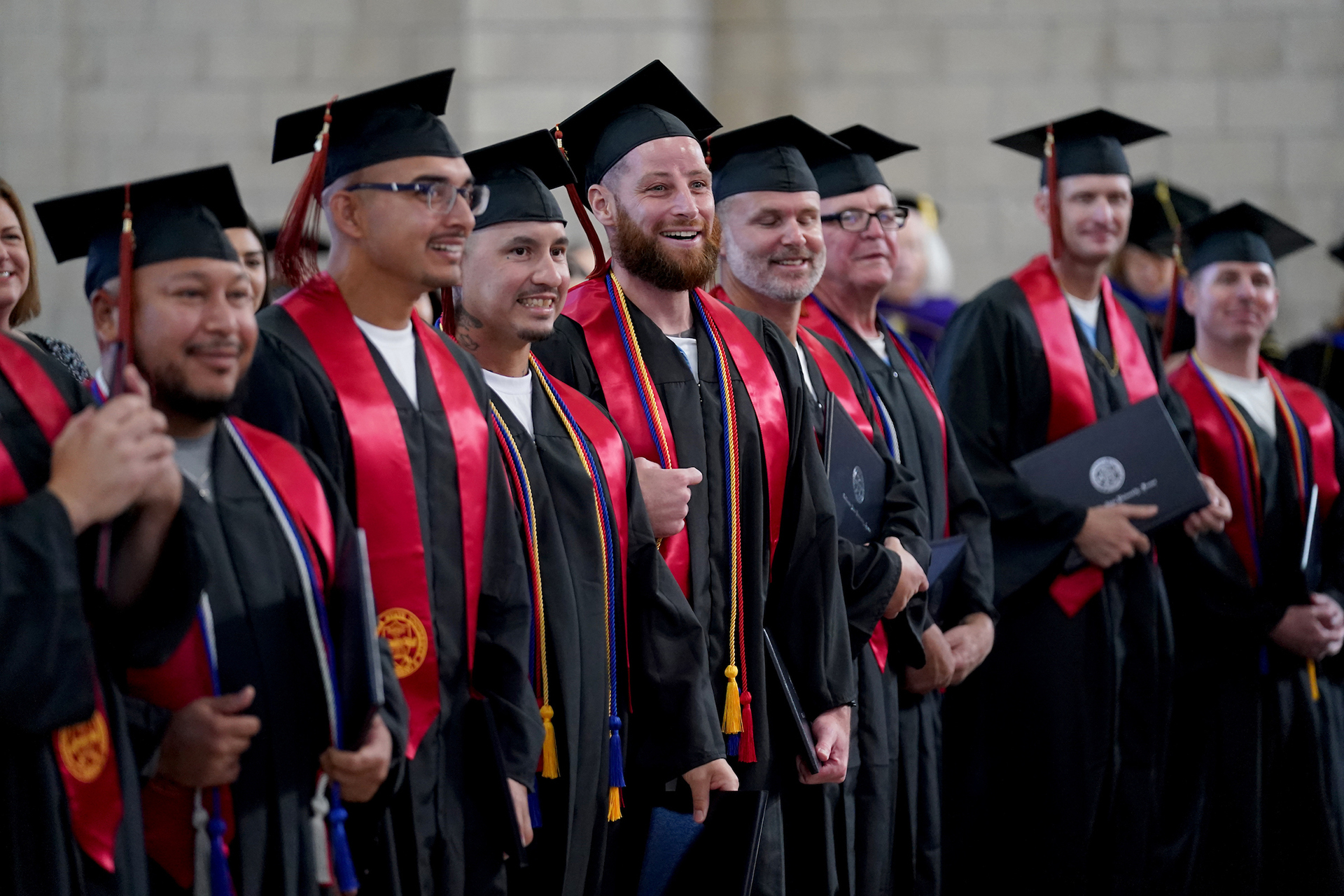 Incarcerated graduates in a line.