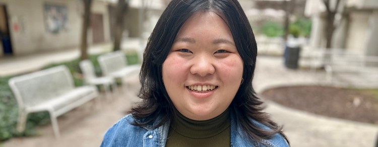 Hope Vang headshot with park benches in the background.