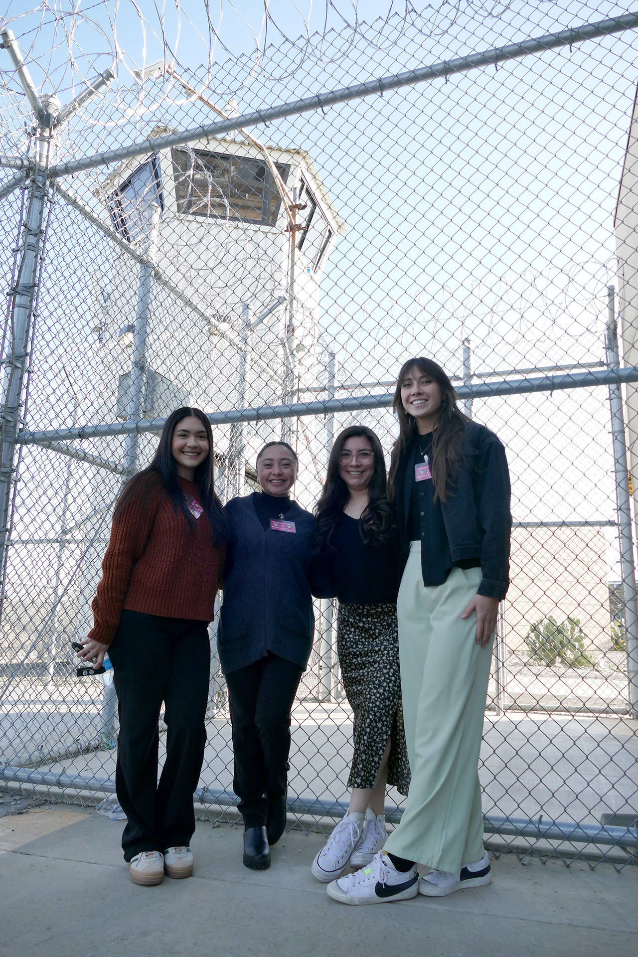 Rhiannon Genilla (right) and other Fresno State Barking Bulldog Debate Team members enter Valley State Prison.