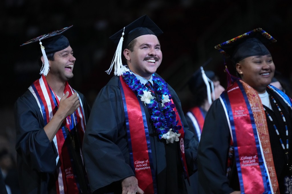 Three grads walk into the Save Mart Center.
