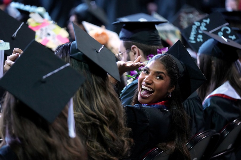 Grad looks back with a big smile.
